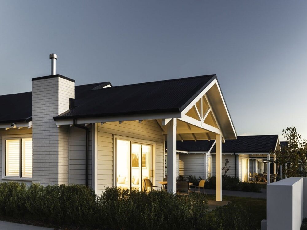 Retirement village villa gabled exterior at night