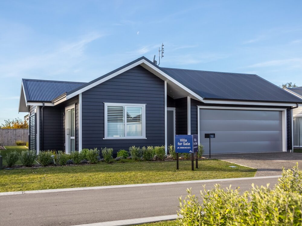 Retirement village villa with black weatherboard exterior